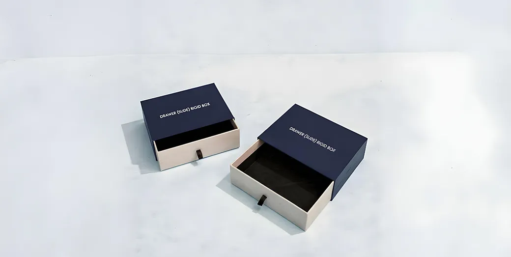 Drawer-style rigid box with sliding sleeve and ribbon pull